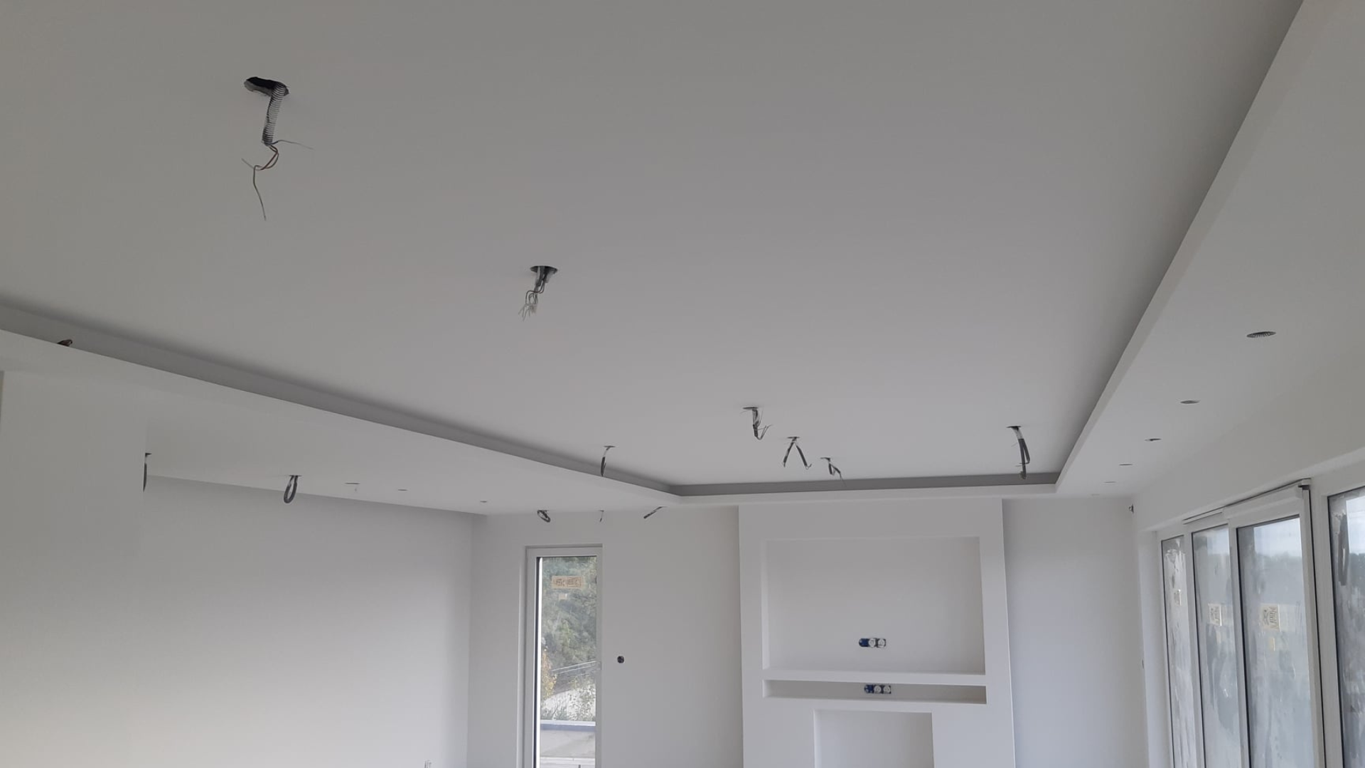 Perimeter light cove and skim-coated finish
