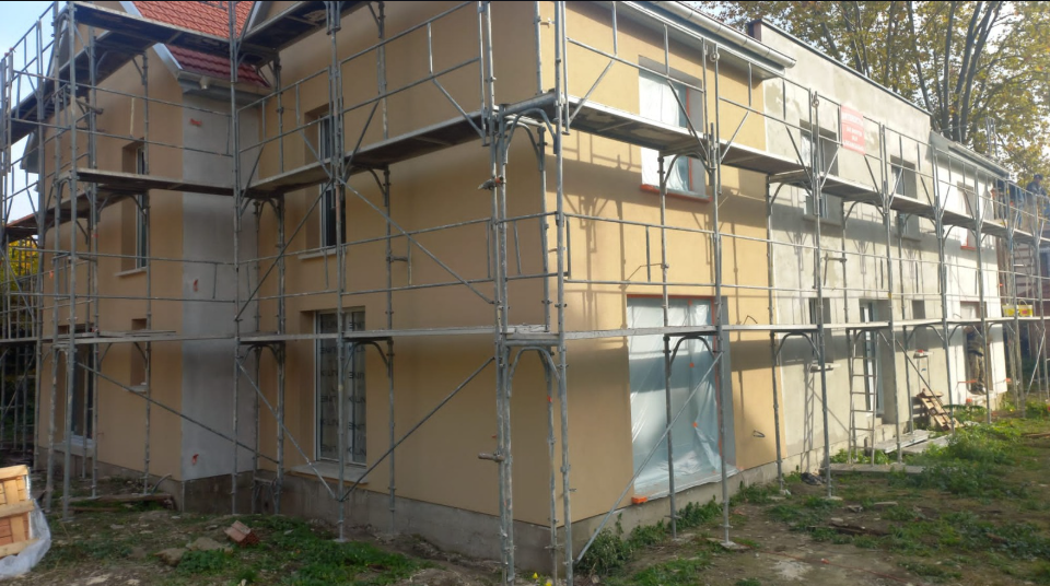 Completed facade — sprayed finish ready for paint